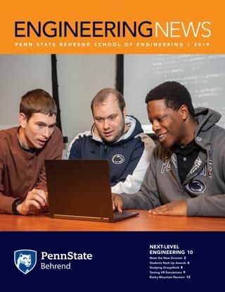 Engineering News - 2019 Cover featuring three male students looking at a laptop