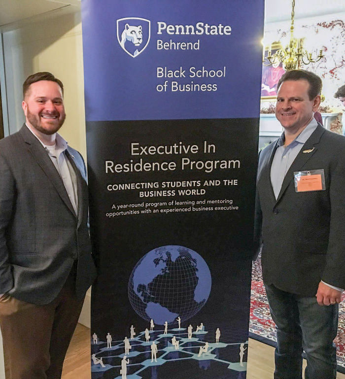 Executives in Residence Justin Bloyd ’05, left, and Mark Nachman, hosted a networking event for Black School of Business students at the college’s Logan House in March.