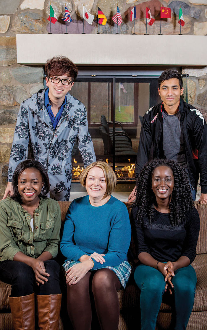 Dr. Mary-Ellen Madigan, senior director of enrollment management, center, with students. Sitting, from left, Mickie Macnicol and Khardiata Mbengue; standing, from left, Arthur Wang and Craig Miranda.