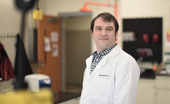 A portrait of Penn State Behrend faculty member Jeremiah Keyes in the college's new microbiology lab.