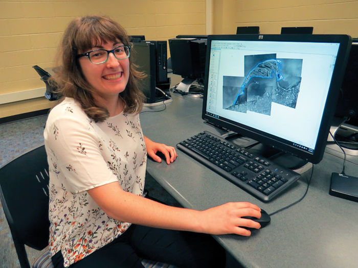 Julia Guerrein, a senior environmental science major, displays GIS mapping software on a computer monitor.