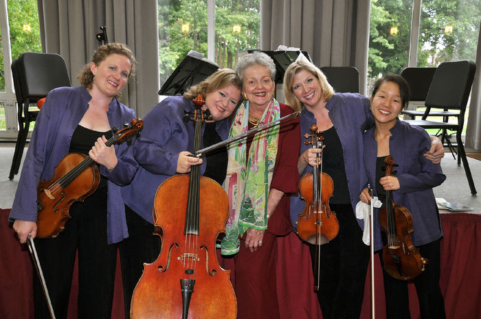 Kay Logan poses with the members of the Cavani String Quartet.
