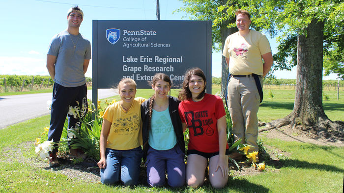 Students standing in front of the Lake Erie Regional Grape Research and Extension Center Sign