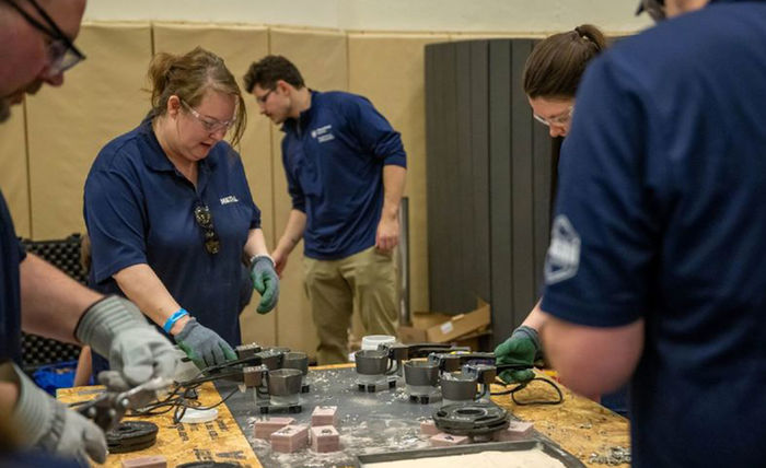 A Behrend teams presenting a metal workshop