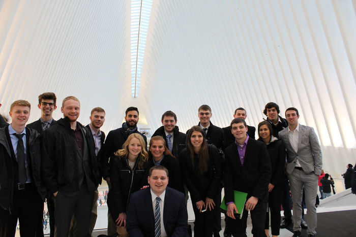 School of Business Students gather in front of a shopping mall just outside of the 9/11 Memorial