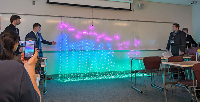 Behrend engineering students showing a lighting display they created