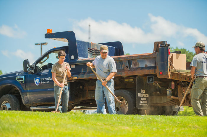 Penn State Behrend Maintenance and Operations staff work outdoors to keep the campus beautiful
