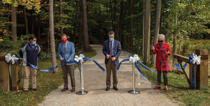 Completion of phase 1 celebrated with virtual dedication. A Sept. 18 ribbon-cutting officially opened the improved trail system at Penn State Behrend’s Wintergreen Gorge. Chancellor Ralph Ford, third from left, was joined by Harborcreek Township Supervisor Tim May, State Sen. Dan Laughlin and Erie County Executive Kathy Dahlkemper.