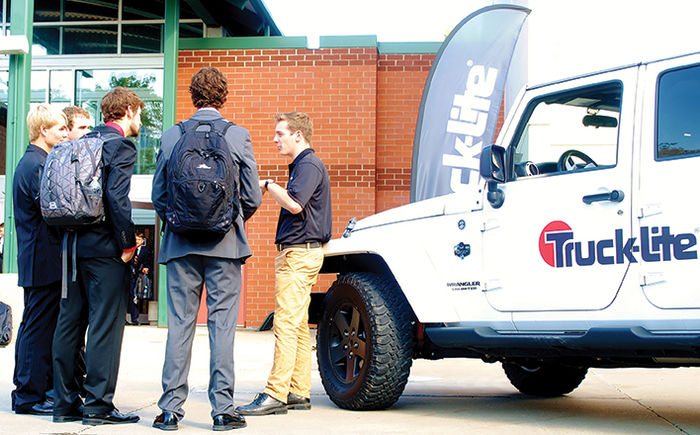 A Truck-Lite recruiter talks with students at a Penn State Behrend career fair.