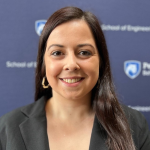 Photo of woman standing in front of Penn State Behrend backdrop