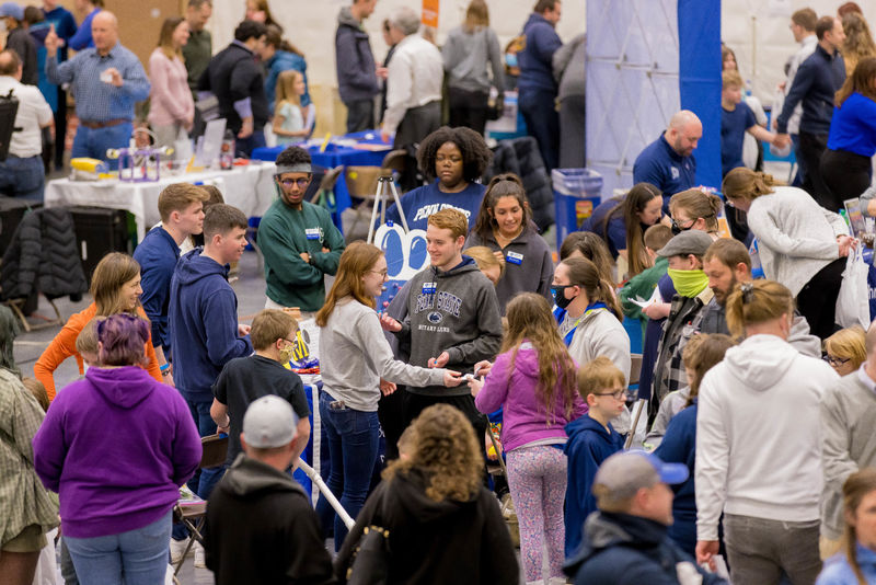 People look at exhibits at the Penn State Behrend STEAM Fair.