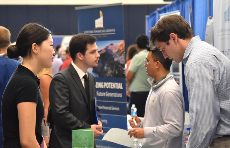 Students talk with recruiters at the Penn State Behrend career fair.