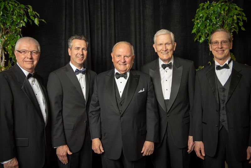 The past four Penn State Behrend leaders pose with Thomas B. Hagen, chairman of the board of Erie Insurance Group