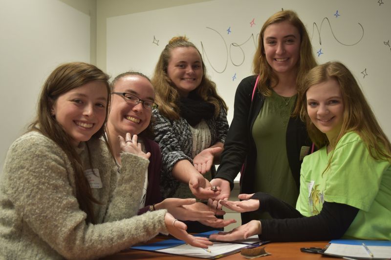 Meadville High School students shown holding their prized battery.