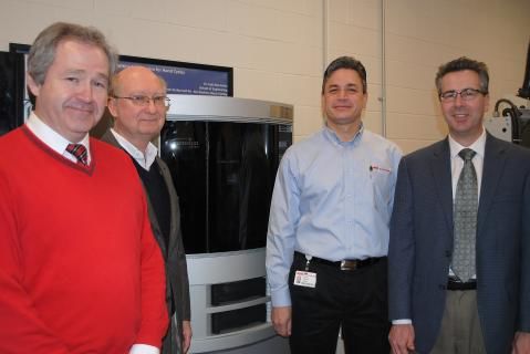 Leaders from the School of Engineering at Penn State Behrend and FMC Technologies Measurement Solutions pose with a 3D printer FMC has donated to the college.
