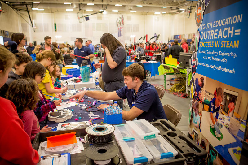 Children and parents look at exhibits at Penn State Behrend's sixth-annual STEAM fair