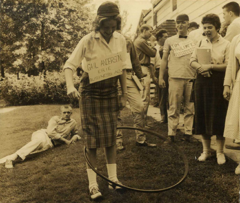 Students mingle with a hula hoop outside Glenhill Farmhouse at Behrend Center