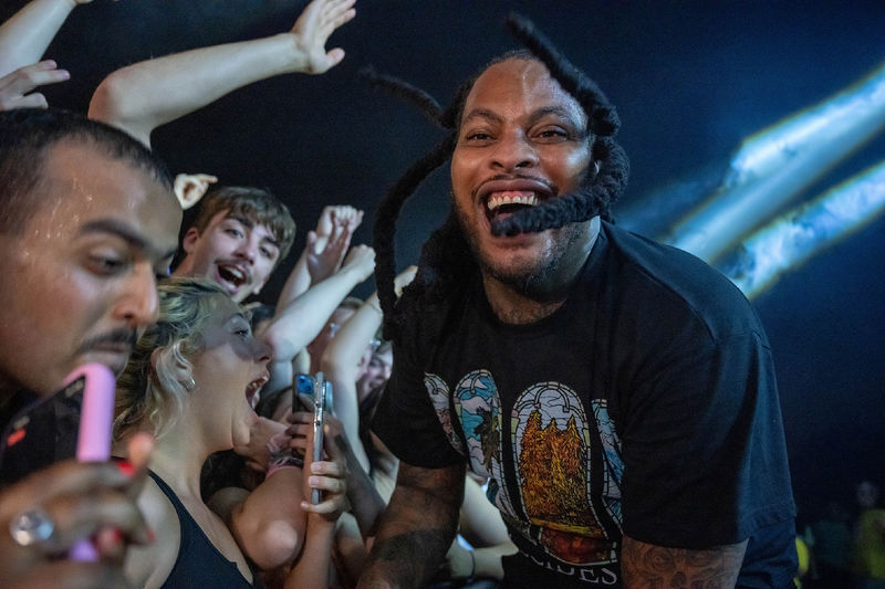 The rapper Waka Flocka Flame enters the crowd during a concert at Penn State Behrend.