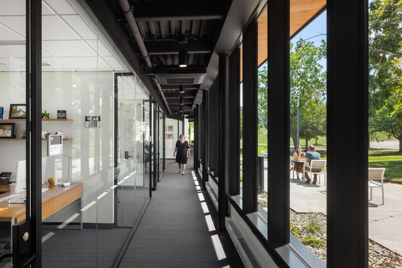 A glass-walled hallway at Penn State Behrend's Federal House