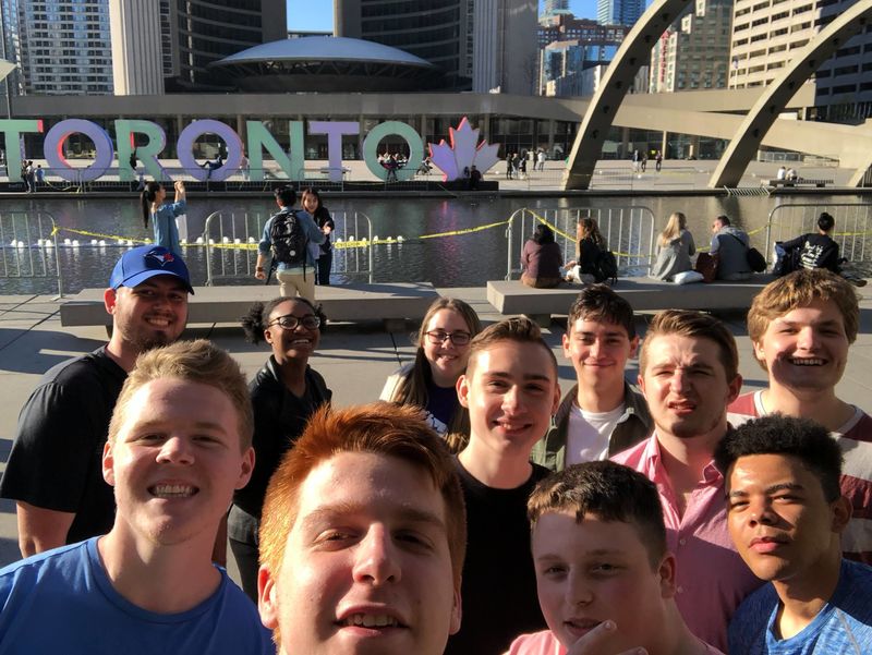 The 2018 group of Penn State study abroad students on the first day of their political science course in Canada at the Toronto sign in front of City Hall