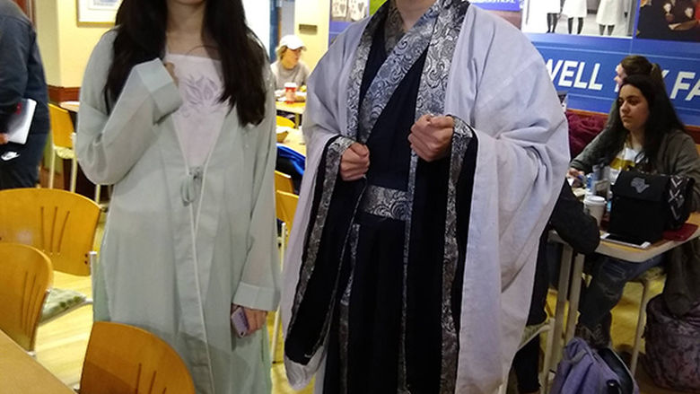 Two students wearing traditional Chinese clothing
