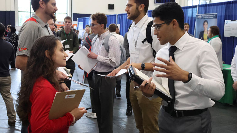 Students talk with recruiters at a Penn State Behrend career fair.