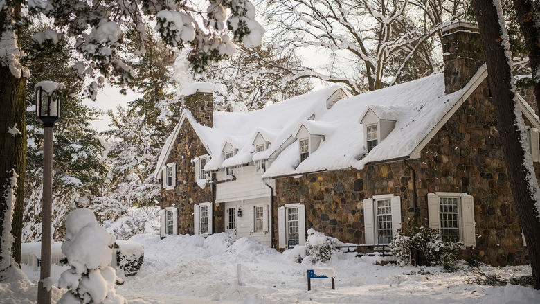 Snow covers the Glenhill Farmhouse at Penn State Behrend.