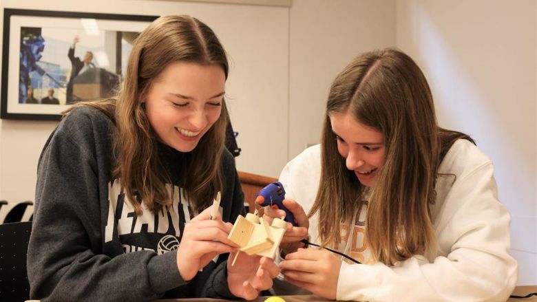 Two high school students complete an engineering task during Penn State Behrend's Women in Engineering day program.