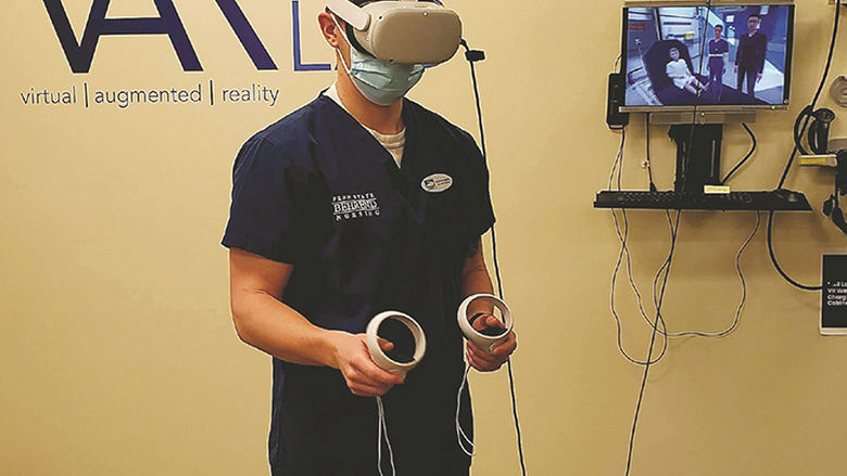 A nursing student learning via patient simulations using virtual reality (VR).