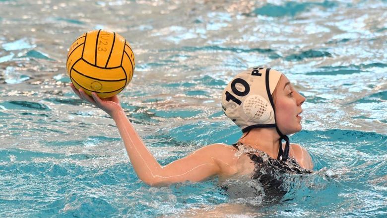 A Penn State Behrend women's water polo team player prepares to throw the ball.