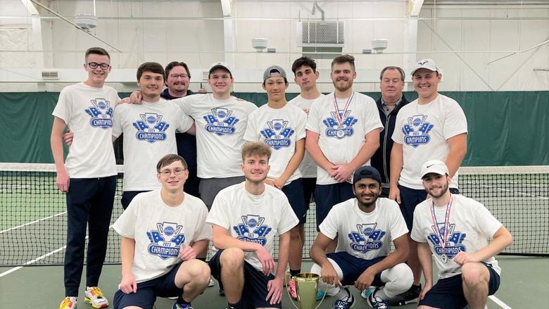 The Penn State Behrend men's tennis team poses with the trophy after winning the AMCC championship.