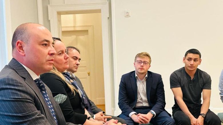 Two students from Penn State Behrend listen to a discussion with the Romanian ambassador during a recent visit to Washington, D.C.