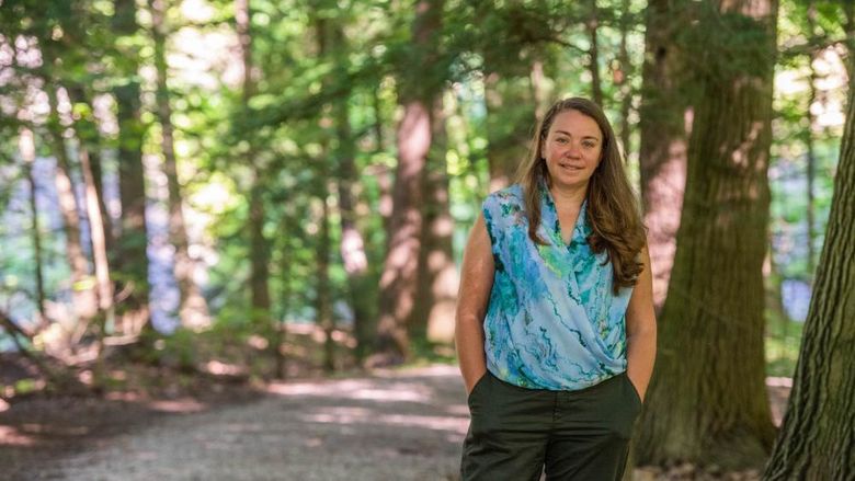 Sam Mason, director of sustainability at Penn State Behrend, poses in Wintergreen Gorge.