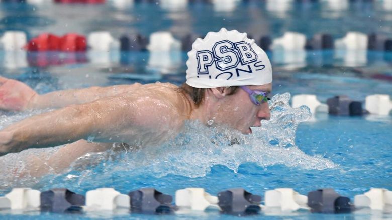 Penn State Behrend swimmer Tim Compton competes in a race.