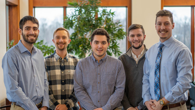 Five Penn State Behrend students pose in Metzgar Center.