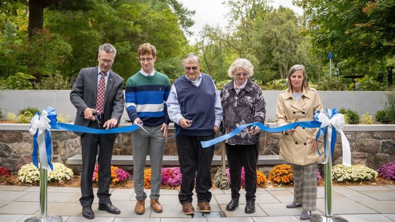 Five guests cut a dedication ribbon at the new Glenhill Gardens at Penn State Behrend