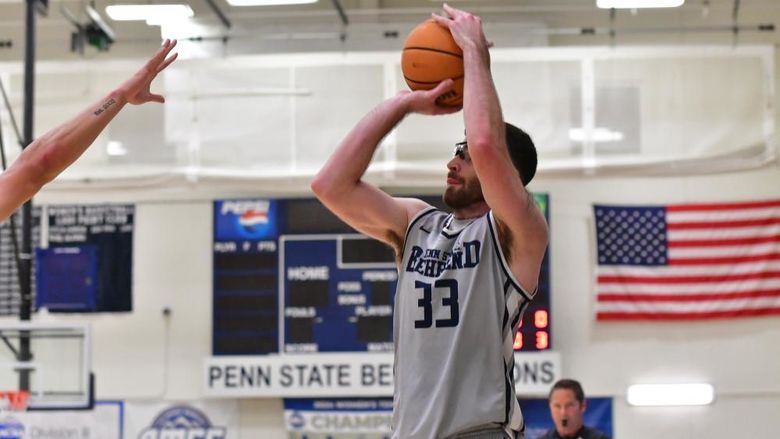 Penn State Behrend basketball player Tommy DiRienzo shoots the ball.