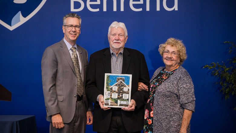 Penn State Behrend Chancellor Ralph Ford presents the Behrend Distinguished Alumni Award to John B. Lloyd and Jean Chambers Lloyd.