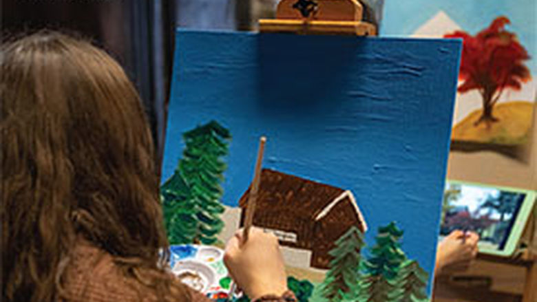 Female student painting in the Mary Behrend studio