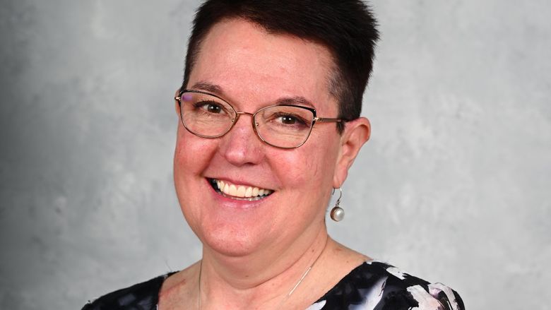 A portrait of Eileen Letson, vice president of finance at PPG Paints Arena