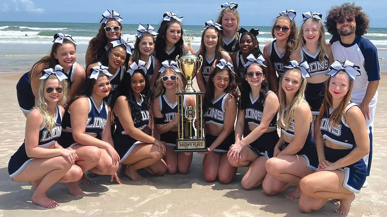 Penn State Behrend’s competitive cheer team recently earned  the college’s first nationally ranked cheerleading trophy.