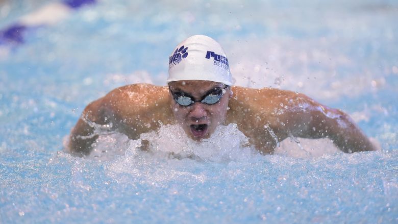 A Penn State Behrend swimmer competes in the butterfly event.