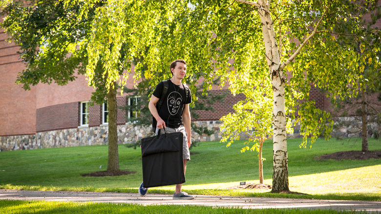 Student walking outside Lilley Library