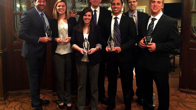 Members of Penn State Behrend's CFA research team pose with trophies