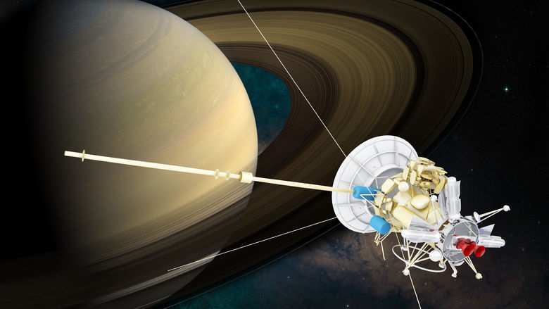 Cassini-Huygens spacecraft pictured next to Saturn.