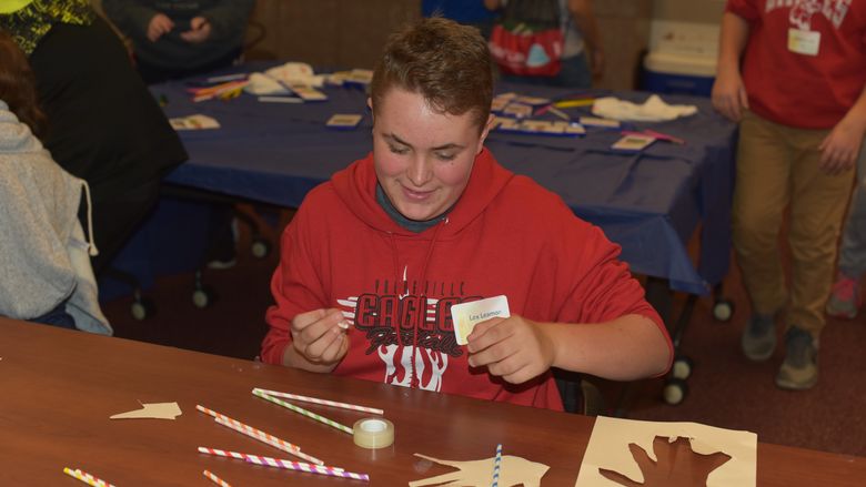 Lex Leamon works to create a mechanical hand during 21st Century Kids, held Friday, Oct. 19, at Penn State Behrend. 