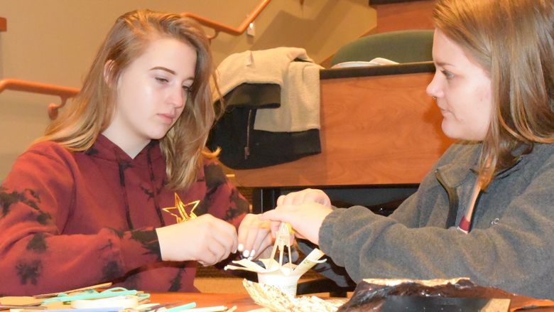 Ani Entrekin, left, and Maygan Stoddard work to create a dome during the Inspiring Bright Futures program, held May 22 at Penn State Behrend.