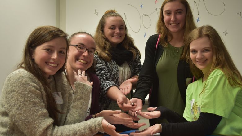 Meadville High School students shown holding their prized battery.