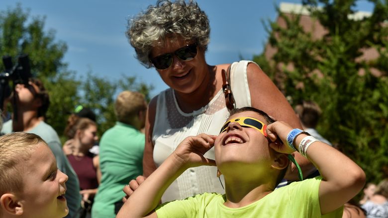 Visitors watch the solar eclipse at Penn State Behrend.