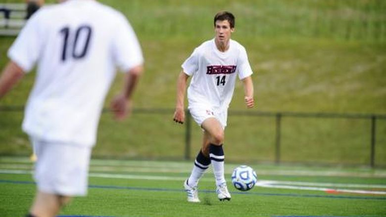 Senior Eric Hackworth looks to pass during a Penn State Behrend soccer game. 
